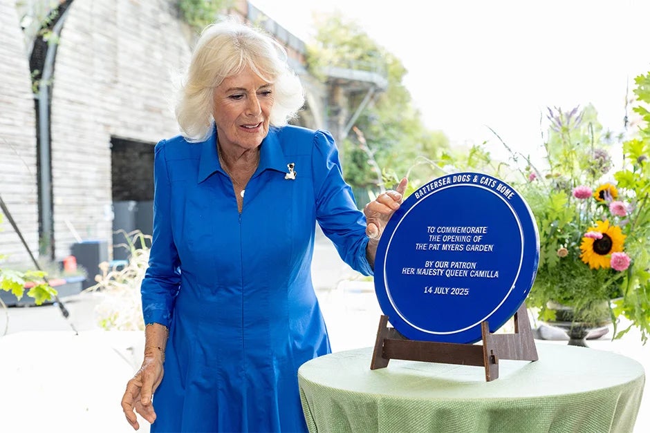 Queen Camilla unveils a plaque