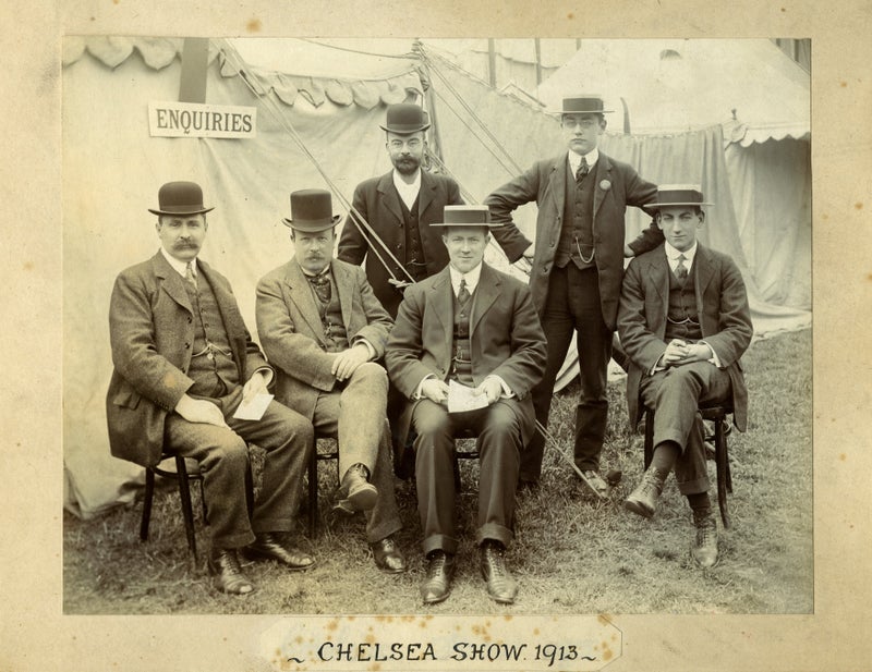 A group of men posing for a photo