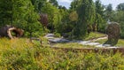 Thumbnail: A path in a park with trees and grass
