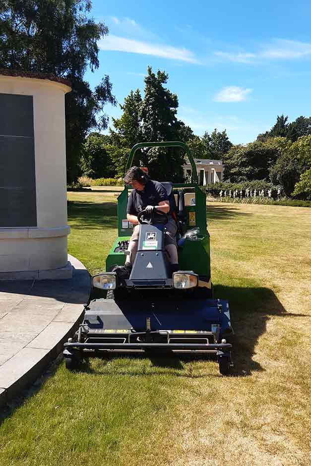 Gardener mowing the lawn