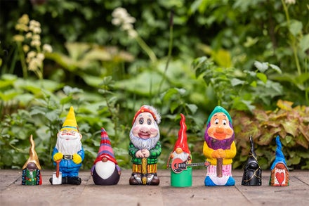 A group of gnomes on a wood surface