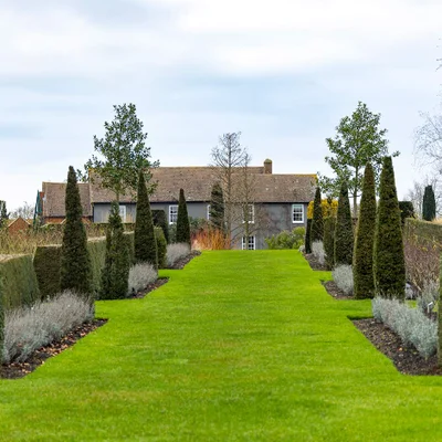 Crisp lawn edges, like these at RHS Garden Hyde Hall, help define borders