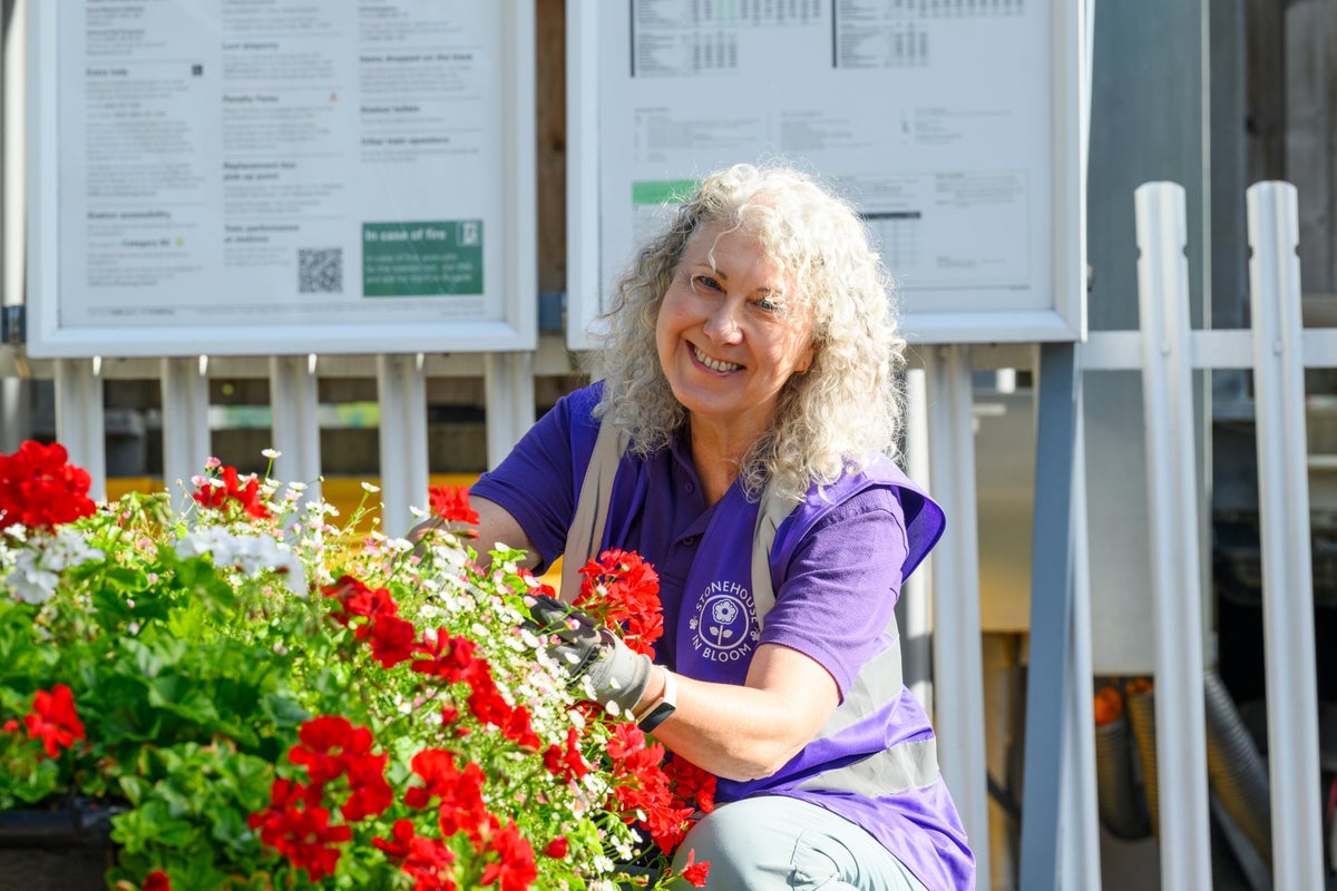 Stonehouse in Bloom volunteer tends floral displays at the local train station