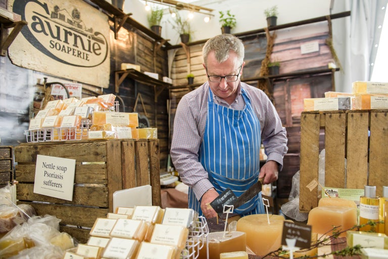 Man working on a cheese tradestand