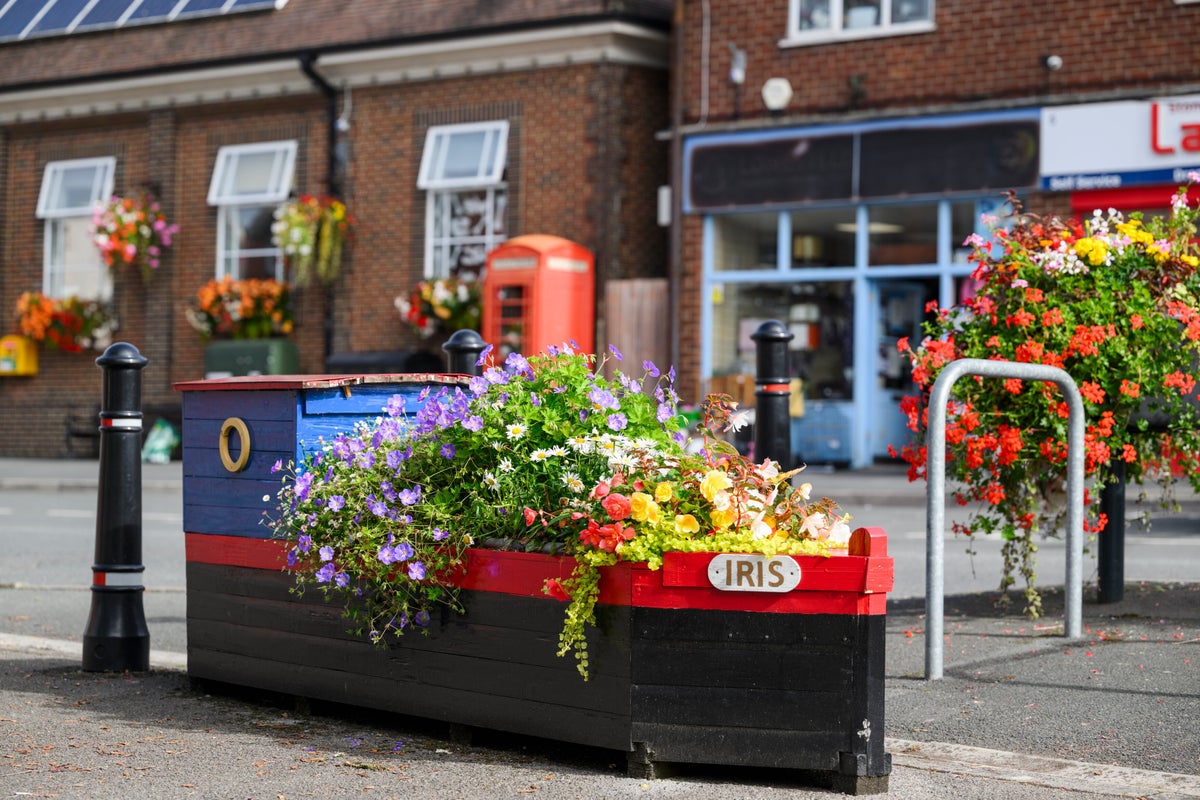 Boat planter filled with colourful flowers in Stonehouse