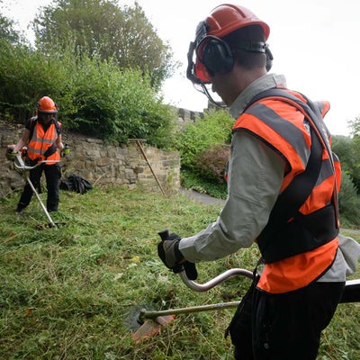 A hard hat, ear defenders and face visor protect from noise and the objects flicked up by a strimmer.