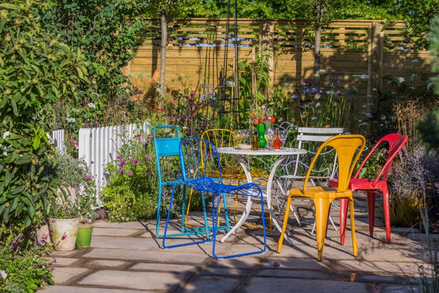 A patio with chairs and table