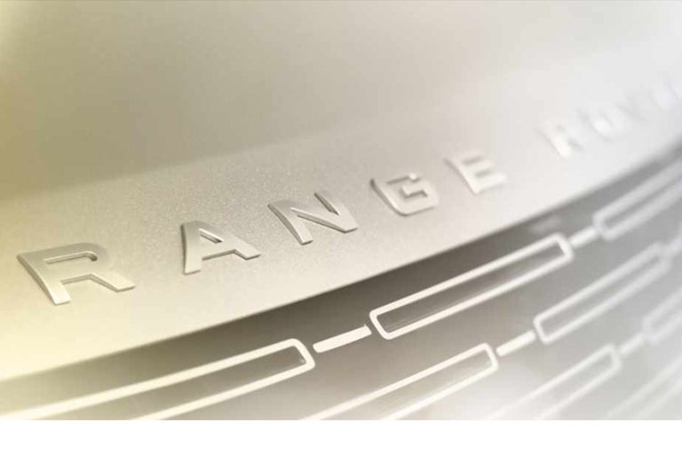 Close-up of a range rover logo