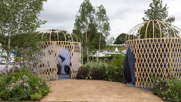 A two round structures with a blue cover