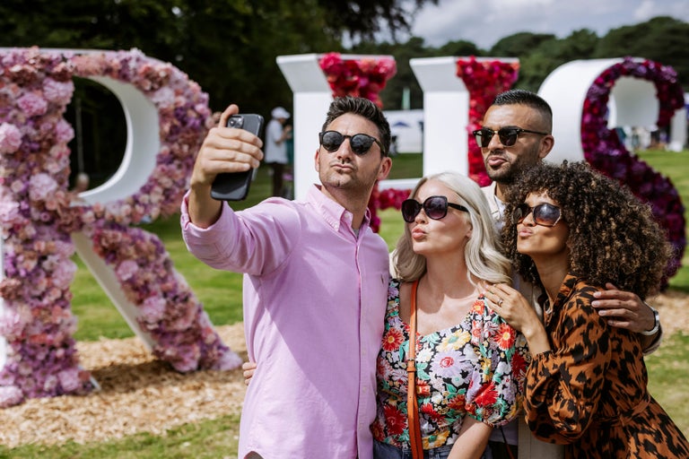A group of people taking a selfie