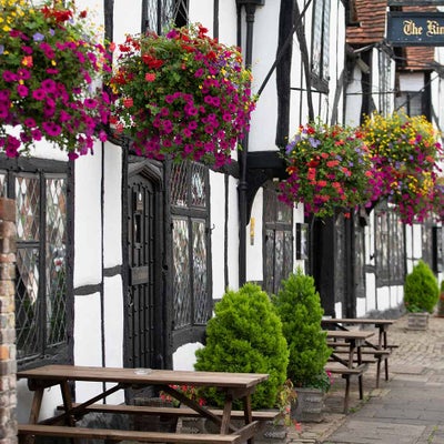 Traditional summer hanging baskets brightening up a street in Amersham