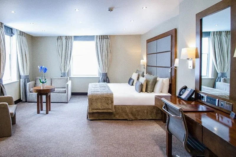 A room with a bed and a desk