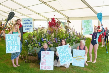 A group of people holding signs
